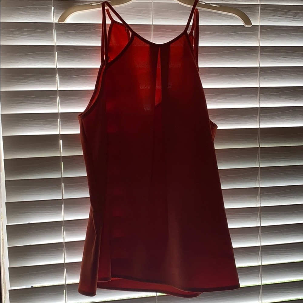 Orange strappy tank. Never worn.
